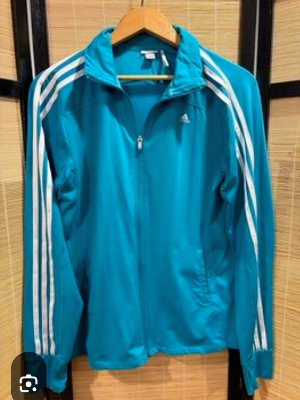 Adidas Women's Teal Zip-Up Track Jacket with Three Stripes.